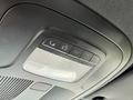 Interior overhead console of a 2023 Mercedes-Benz Sprinter featuring control buttons and a light fixture