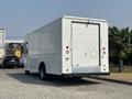 A white 2018 Ford Econoline cargo van with a closed rear door and a simple design