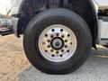 Close-up of a 2016 Freightliner M2 106 tire showing the Goodyear brand and metal wheel rim with multiple bolts