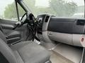 Interior view of a 2016 Mercedes-Benz Sprinter showing driver and passenger seats dashboard and steering wheel