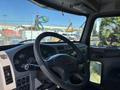 Interior view of a 2015 Peterbilt 337 truck showing the steering wheel and dashboard with various gauges and controls