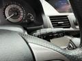 Close-up of the control stalk for windshield wipers in a 2014 Honda Odyssey with the speedometer and dashboard display partially visible