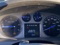 Dashboard of a 2007 Cadillac Escalade showing odometer reading of 253895 km with speedometer tachometer and warning lights