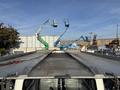 2022 Freightliner M2 106 with a flatbed featuring metal rails and chains visible on top