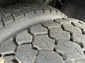 Close-up of two truck tires showing detailed tread patterns on the rubber surface highlighting their rugged appearance and grip features