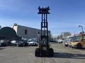 A 1993 Hyster H80XL forklift with a raised mast and empty forks positioned at the top