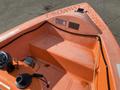 A 2007 Fassmer 20 Foot Fast Rescue Boat in bright orange with a central console and an empty interior space visible