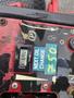 Close-up of a 2017 Ferris Rotary control panel featuring an hour meter displaying 69.5 hours and a sticker indicating the next oil change is at 750 hours