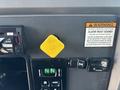Interior dashboard of a 2015 Peterbilt 337 featuring control buttons a gear shift lever and a yellow parking brake release knob