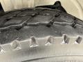 Close-up of a treaded tire from a 2005 Freightliner M2 106 showing detailed tire patterns and textures