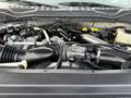 Close-up view of the engine bay of a 2017 Ford F-450 Super Duty featuring various engine components and tubing