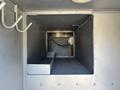 Interior of a 2005 Freightliner M2 106 truck showing a large empty cargo space with metal walls and a silver floor