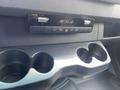 Dashboard controls and cup holders of a 2025 Mercedes-Benz Sprinter
