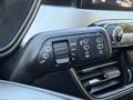 A close-up of the control stalk in a 2020 Ford Escape featuring buttons for windshield wipers and lights