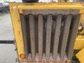 Close-up of the grinding chamber of a 2010 Vermeer Corporation BC1000XL wood chipper showing vertical slats and textured surfaces