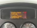 Dashboard display of a 2016 Peterbilt 348 showing engine make as PACCAR and engine model as 2013 PX9 with various gauges visible