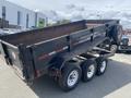 A 2009 Load 16 foot Dump Trailer with a raised dump bed showing its metal body and three wheels on a dual axle setup