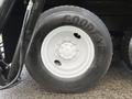 Close-up of a Goodyear tire mounted on a white wheel from a 2016 International 7400 truck with tread visible on the rubber surface