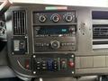 Dashboard of a 2020 Chevrolet Express featuring controls for air conditioning audio system and various switches including shift lock and power settings