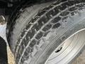 Close-up of a tire from a 2017 Ford F-450 Super Duty showing tread patterns and sidewall details