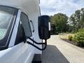 A 2020 Chevrolet Express van with a side view mirror attached displaying its sleek design and sturdy frame
