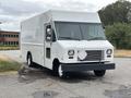 2018 Ford Econoline delivery truck with a white exterior and rectangular body design positioned at an angle