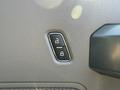 Close-up of a power lock button on the interior door panel of a 2022 Ford F600
