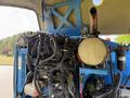 2012 Genie Z 45/25 with visible engine components and wiring including a cylindrical fuel tank and various hoses and electrical connections