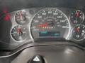Dashboard of a 2018 Chevrolet Express showing speedometer fuel gauge temperature gauge and odometer reading 208557 km with a temperature of 19 degrees Celsius