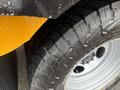 Close-up of a textured tire on a 2021 Ford Econoline showing deep treads and metallic rim