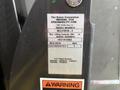 2014 Ford E-350 with a label detailing model number NCL19FIB-2 lifting capacity of 800 lbs serial number 191216126262 and manufacturing date 12162019