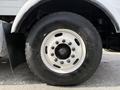 A close-up of the wheel and tire of a 1996 Kenworth T800 showing the white rim and black tire with visible tread patterns