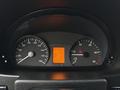 A close-up view of the dashboard of a 2017 Mercedes-Benz Sprinter featuring analog speedometer and tachometer alongside a digital display showing various metrics
