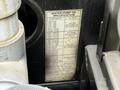 Close-up of a water pump oil specification label attached to a 2016 Peterbilt 348 with details about pump models and oil types
