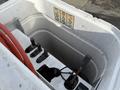 Close-up of the control panel of a 2012 International DuraStar 4300 featuring levers and knobs with visible wiring and hoses