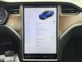 A 2020 Tesla Model X displayed on a touchscreen interface featuring options for vehicle settings and software details