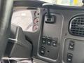 Interior dashboard of a 2013 Freightliner 114SD with gauges and control switches visible