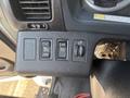 Close-up of the control panel in a 2012 Hino 338 featuring buttons for setting options and indicators for various functions