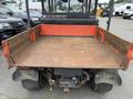 A 2011 Kubota RTV 1140 CPX with a flatbed features rusty metal sides and a textured surface designed for transporting cargo