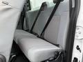 A 2015 Ford F-350 SD with a rear bench seat featuring fabric upholstery and safety seat belts