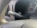 Close-up of the control stalk on a 2021 Chevrolet Express featuring wiper settings and turn signal controls
