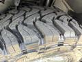 Close-up of a large rugged tire with deep treads designed for off-road use mounted on a 2020 Ram 2500