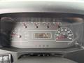 Dashboard of a 2022 International MV607 showing speedometer, tachometer, fuel gauge, and digital display with odometer reading 125298 kilometers