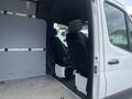 2025 Mercedes-Benz Sprinter with two front seats visible and a spacious cargo area behind them