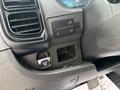 The interior dashboard panel of a 2023 RAM Promaster 3500 featuring control buttons and a storage compartment