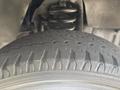 Close-up of a tire from a 2012 Ford E-450 showing detailed tread pattern and sidewall design