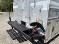 A 2008 Workhorse W62 truck featuring a silver metallic body, a rear bumper with a black step and handholds, and visible red brake lights