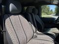 Interior view of a 2012 Ford F-350 SD showing the rear bench seat with patterned fabric covers