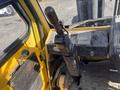 Close-up of the control lever and dashboard of a 1993 Hyster H80XL forklift with a yellow and black color scheme