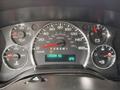 Dashboard of a 2013 Chevrolet Express showing speedometer fuel gauge and odometer reading 135384 km with temperature display of 6 degrees Celsius